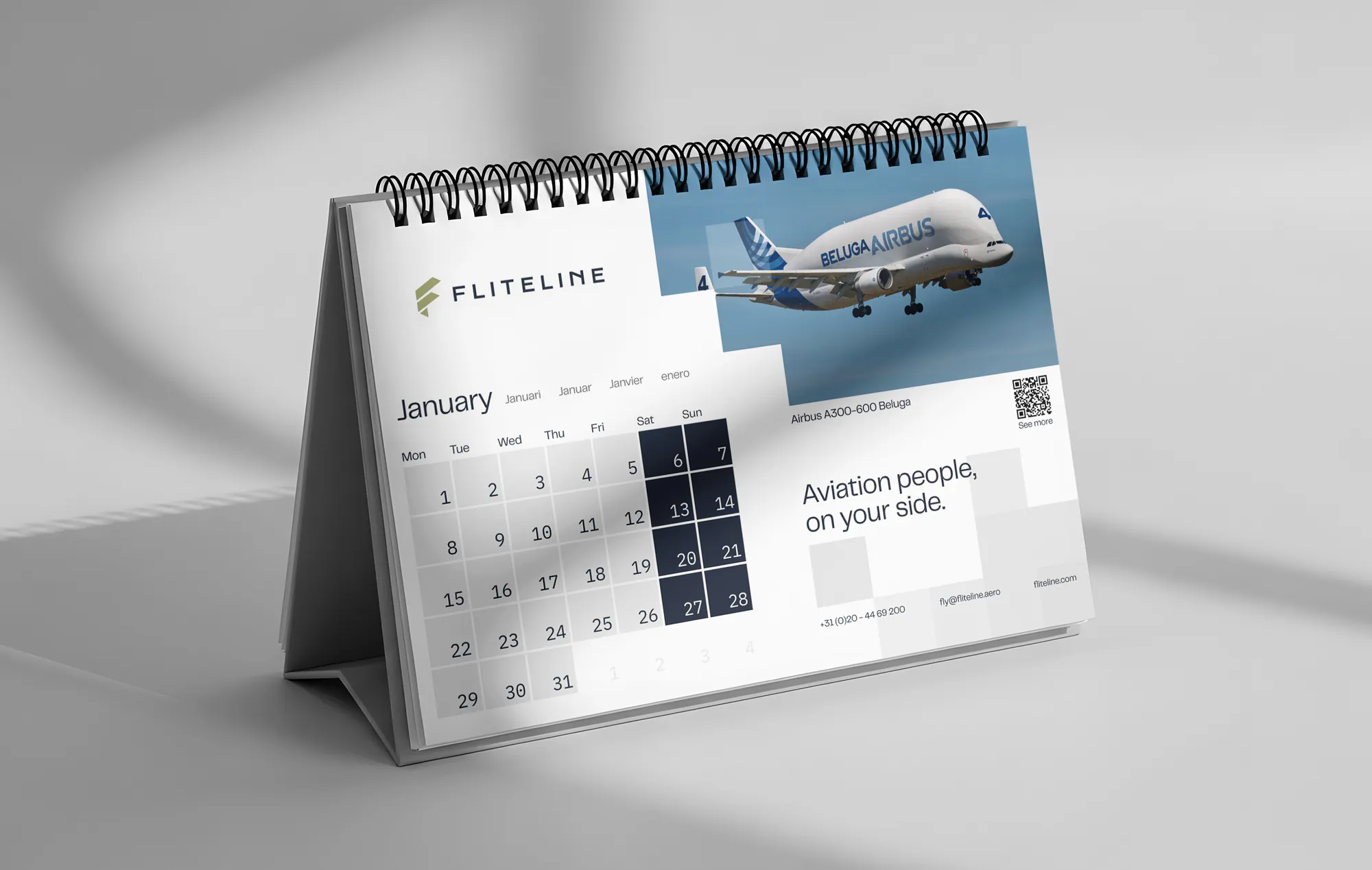 A calendar mockup showing the identity applied across print and everyday brand touchpoints.